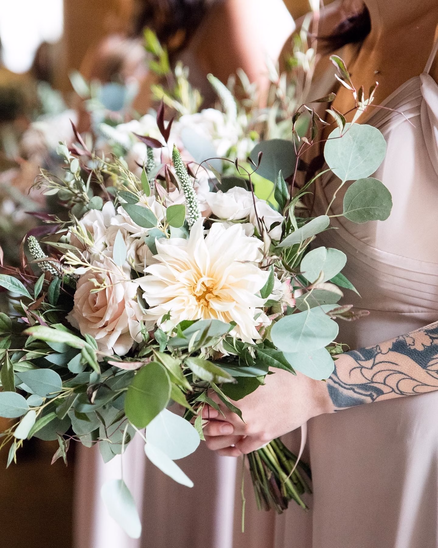 Elegant bridal bouquet with white dahlia and eucalyptus designed by Chicago wedding florist for Rochester NY wedding