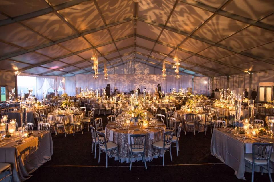 elegant wedding reception tent decor chicago rochester erin mcdonald - Destination Event Design Elegant wedding reception tent with chandeliers and floral centerpieces designed by Chicago and Rochester wedding designer Erin McDonald