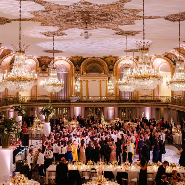 Elegant wedding reception at Palmer House Hilton Chicago with crystal chandeliers and ornate ceiling designed by Erin McDonald