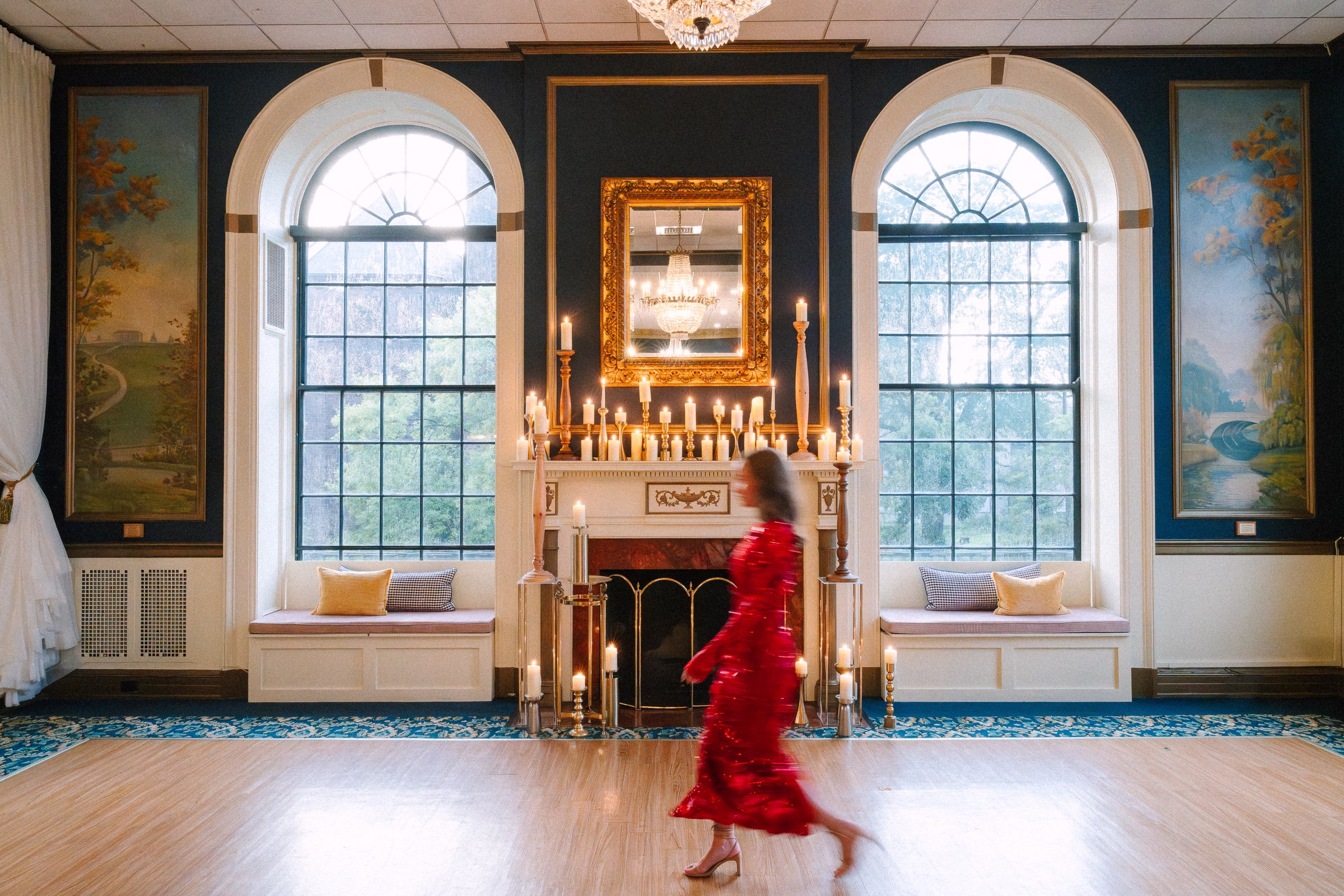 Elegant ballroom with arched windows, fireplace and ornate details at Rochester NY wedding venue during venue consulting session