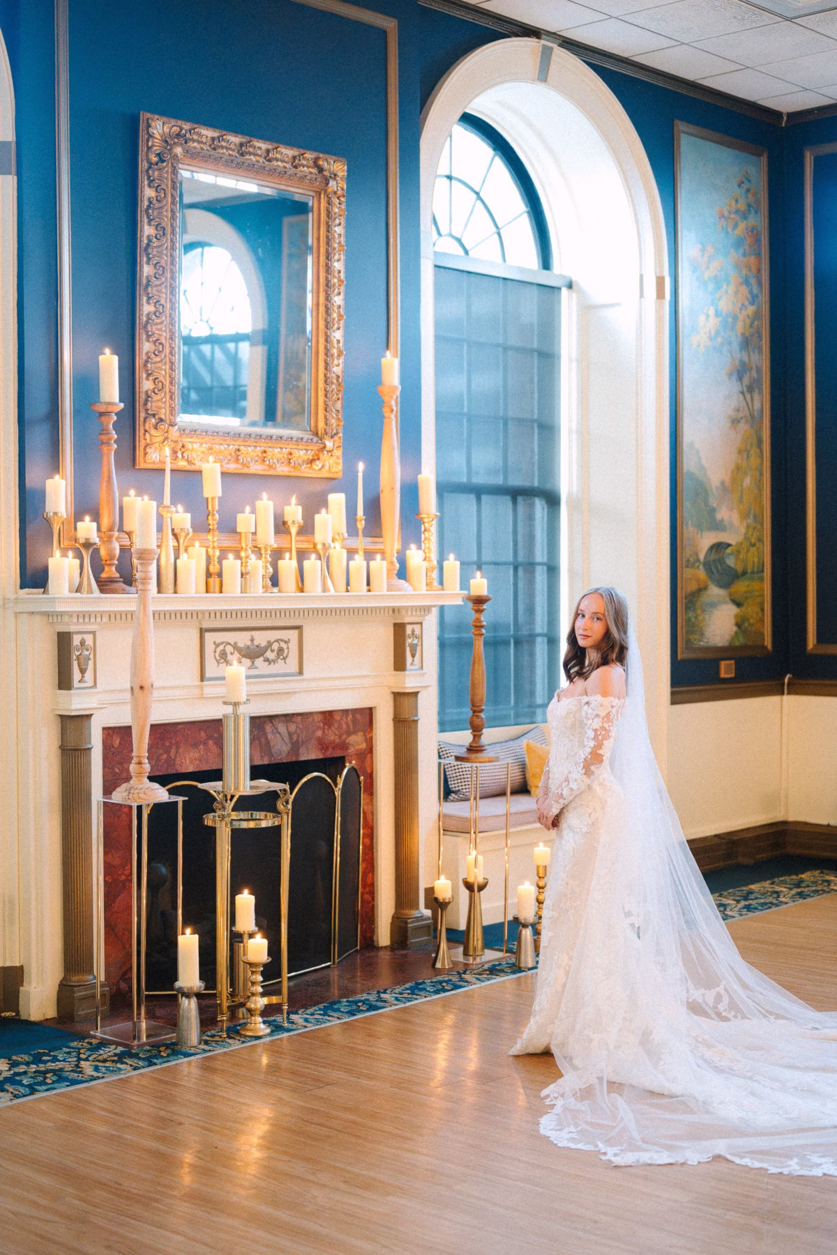 Elegant candlelit wedding ceremony setup with bride in lace gown at Inn on Broadway Rochester by wedding designer Erin McDonald