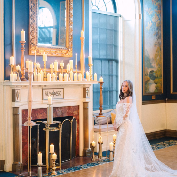Elegant candlelit wedding ceremony setup with bride in lace gown at Inn on Broadway Rochester by wedding designer Erin McDonald