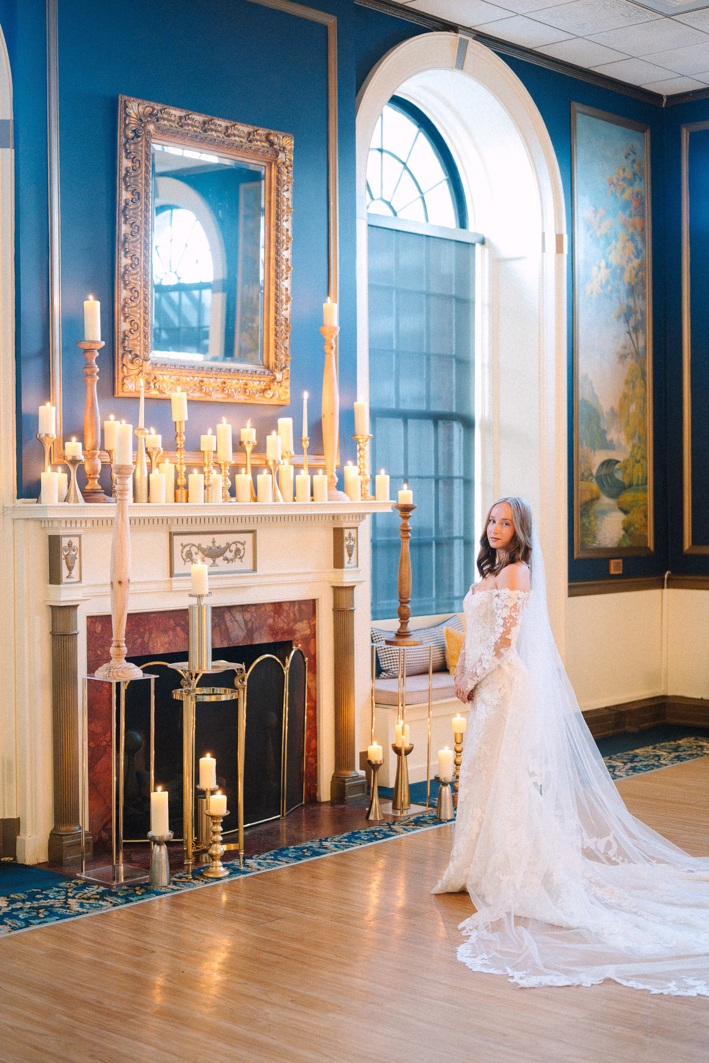 Elegant candlelit wedding ceremony setup with bride in lace gown at Inn on Broadway Rochester by wedding designer Erin McDonald